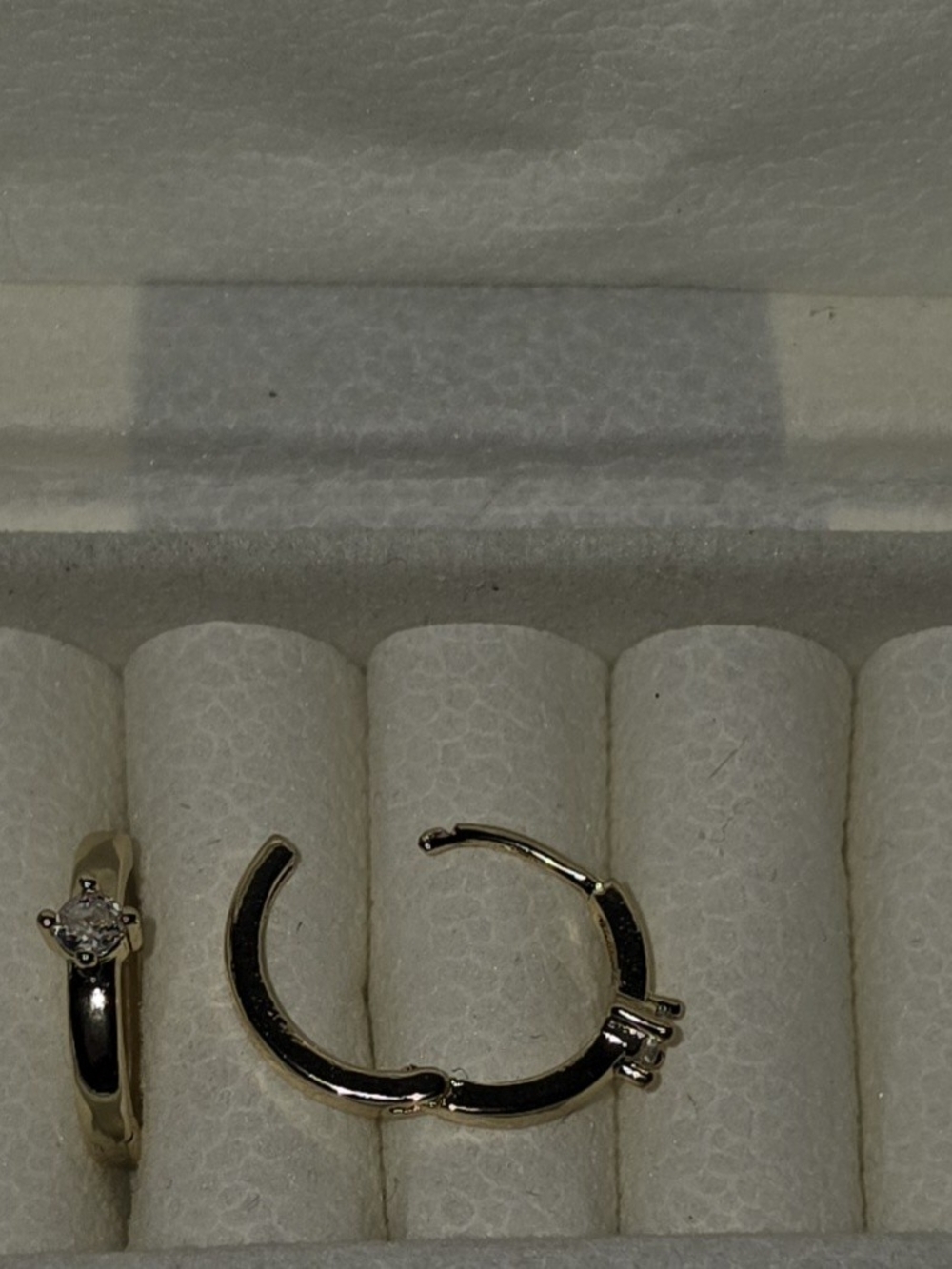 Dainty Gold Huggie Hoop Earrings Featuring A Small Prong-Set Solitaire Crystal